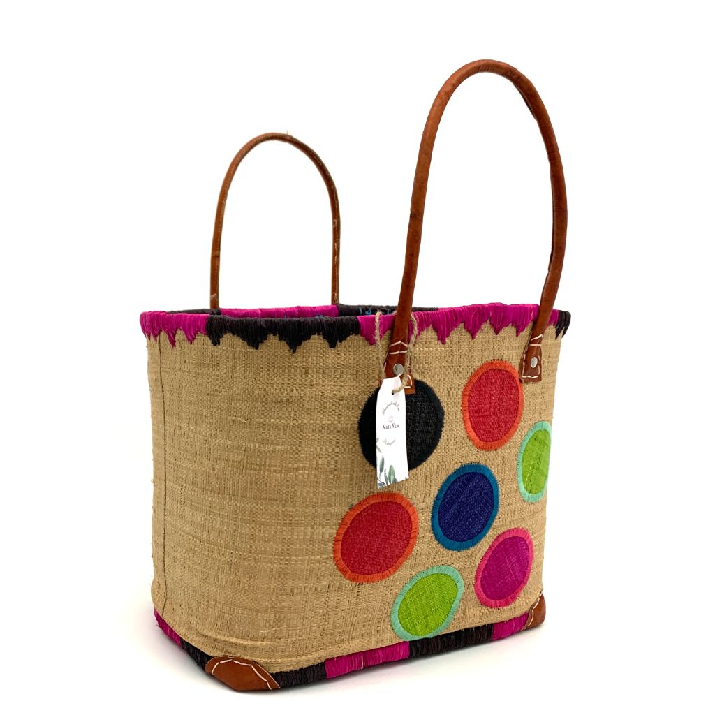 The Beige Raffia baskets with dotted embroidery, inside pocket & leather handle.3 different sizes and very spacious and durable.Handmade in Madagascar with love.