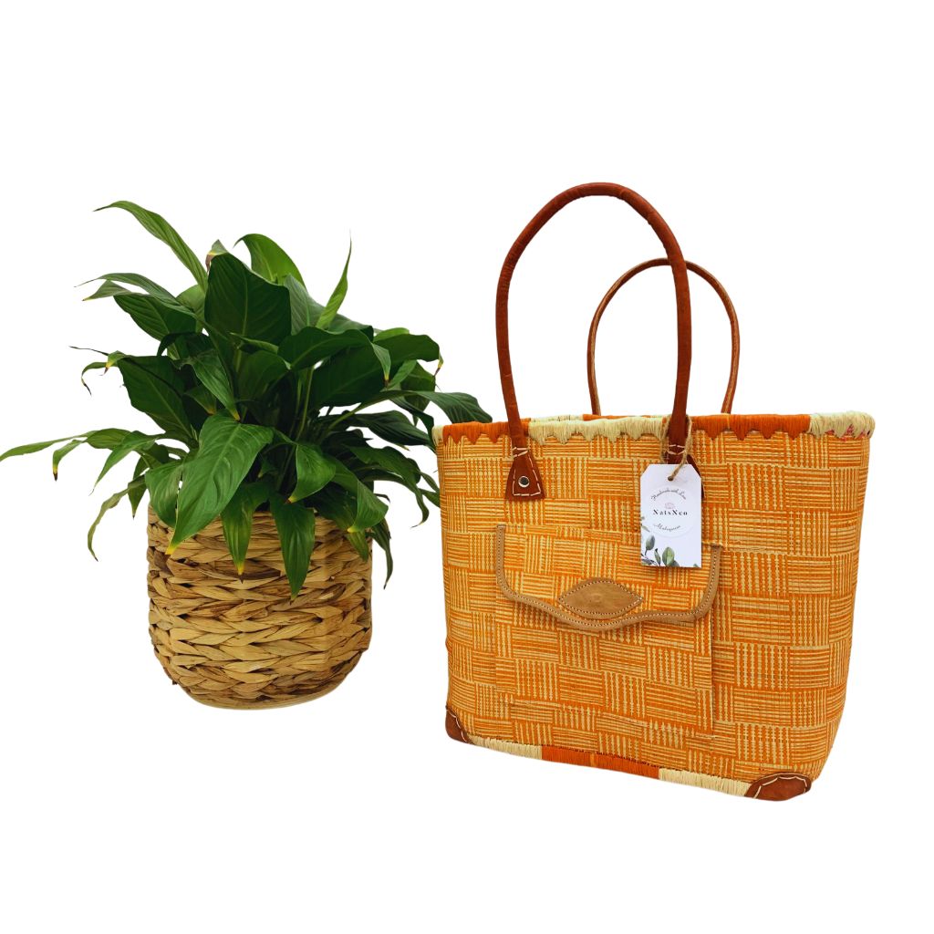 Orange raffia basket in 3 different sizes, with front and inside pockets & leather handle. Handmade in Madagascar with love.