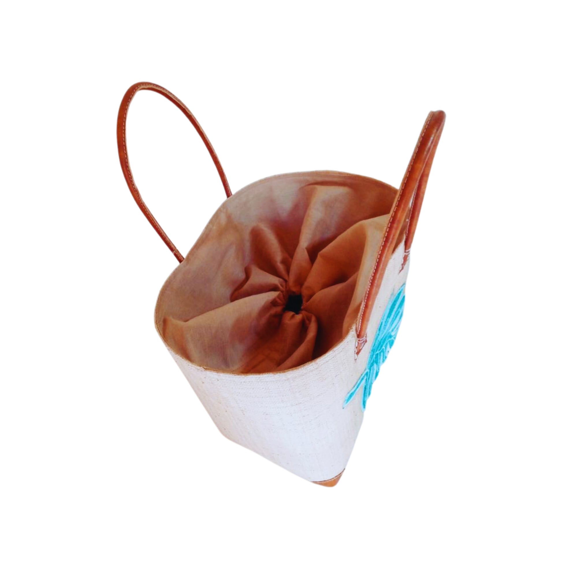 NatsNco handmade raffia, women,beige basket with turquoise leaf embroidery and leather handle & drawstring closure. Made in Madagascar